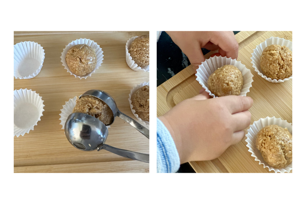Mogyoróvajas energiagolyók mini muffinpapírban, baba kéz nyúl utánuk